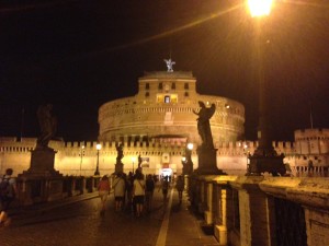 I love how one of the angel statues from the bridge is silhouetted against the castle in this photo. 