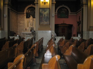 The pew from which a character gazes at the painting