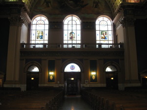 Doors and stained glass windows inside Our Lady of Sorrows