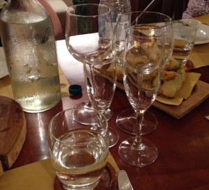 A different type of  glass for each type of wine, plus a glass of water for good measure